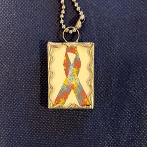 Puzzle Ribbon Pendant Necklace